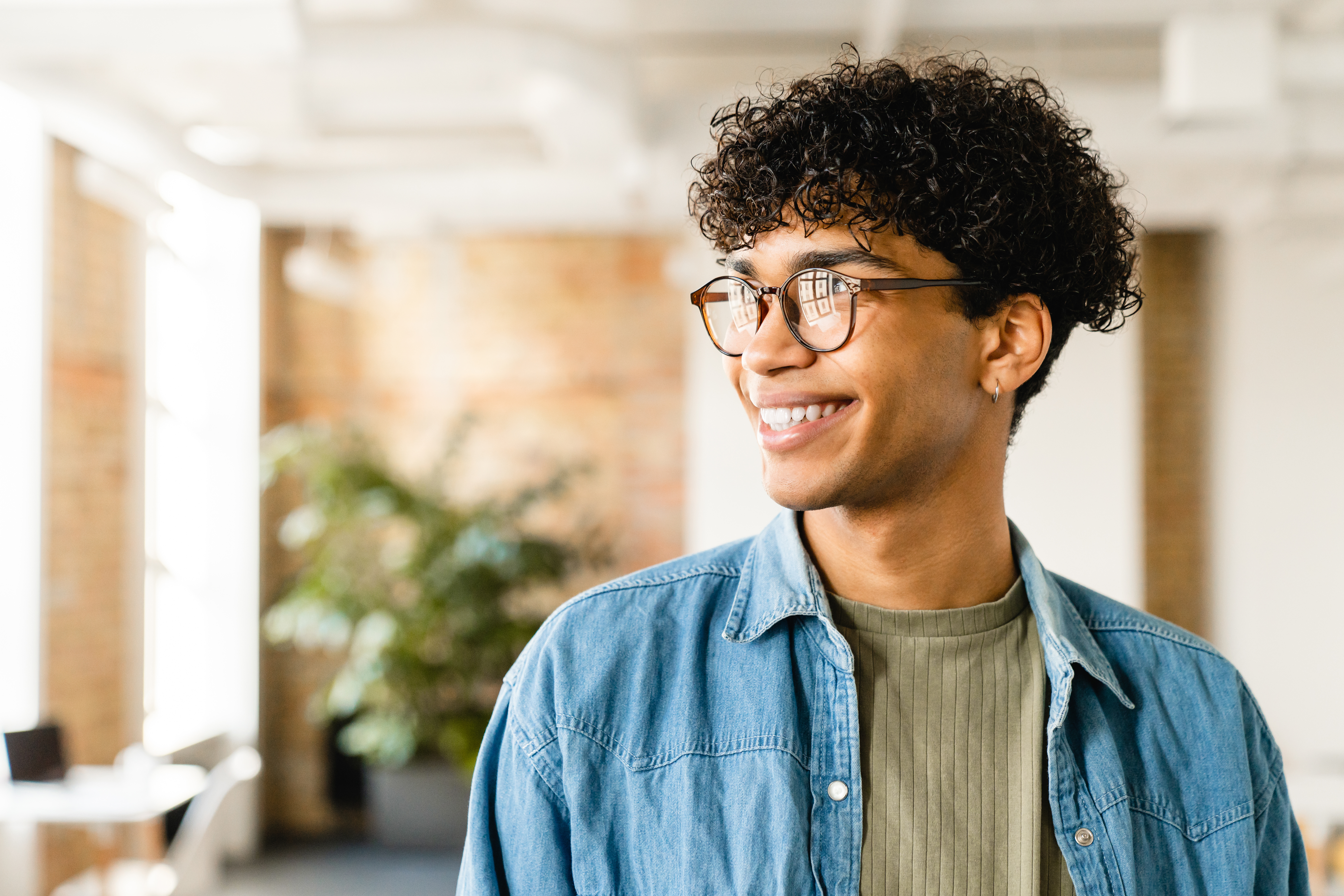 Young man in casual clothing in office