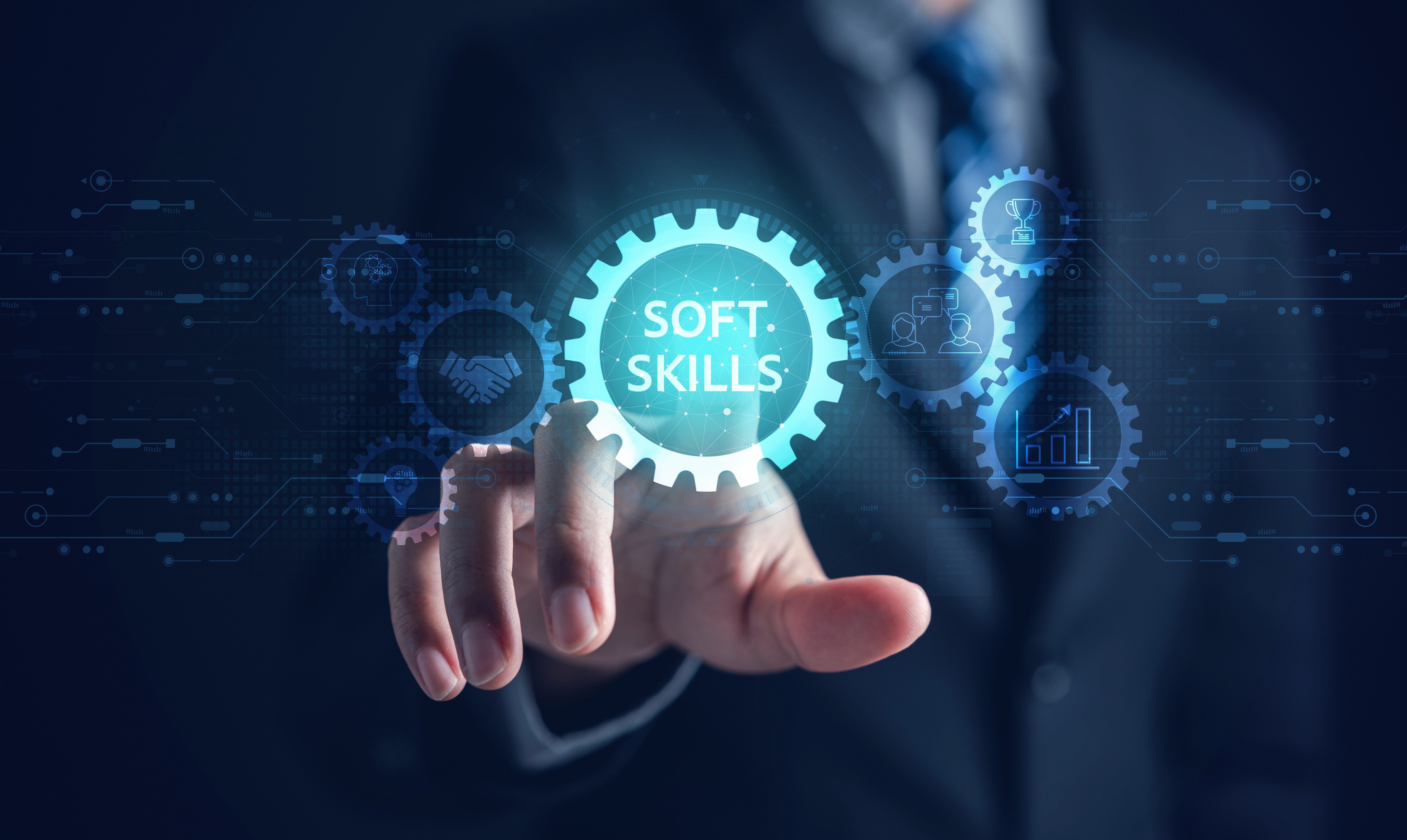Person pushing soft skills button on a projected modern interface